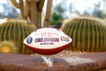 Chris Dufresne, who recently retired from the Los Angeles Times, received this commemorative football as the 2015 FWAA Beat Writer of the Year. Photo by Melissa Macatee.